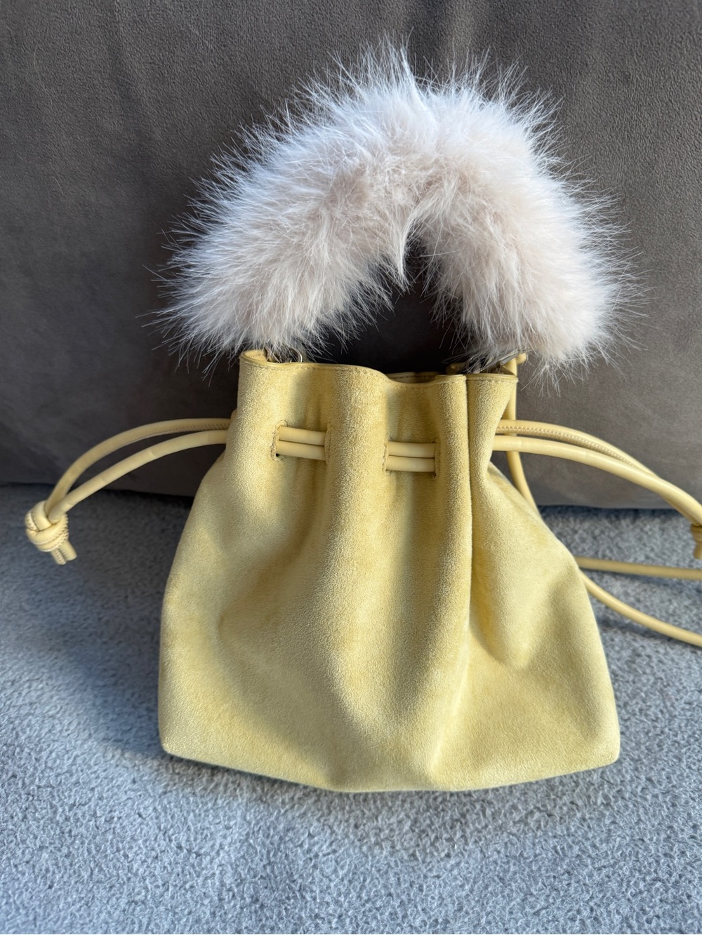 Anthropologie Yellow Suede Drawstring Mini Bag with Cream Faux Fur Handle